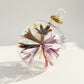 Fair trade hand-blown glass ornament with floral design inspired by Renoir's Bouquet of Chrysantemums, ethically handcrafted
