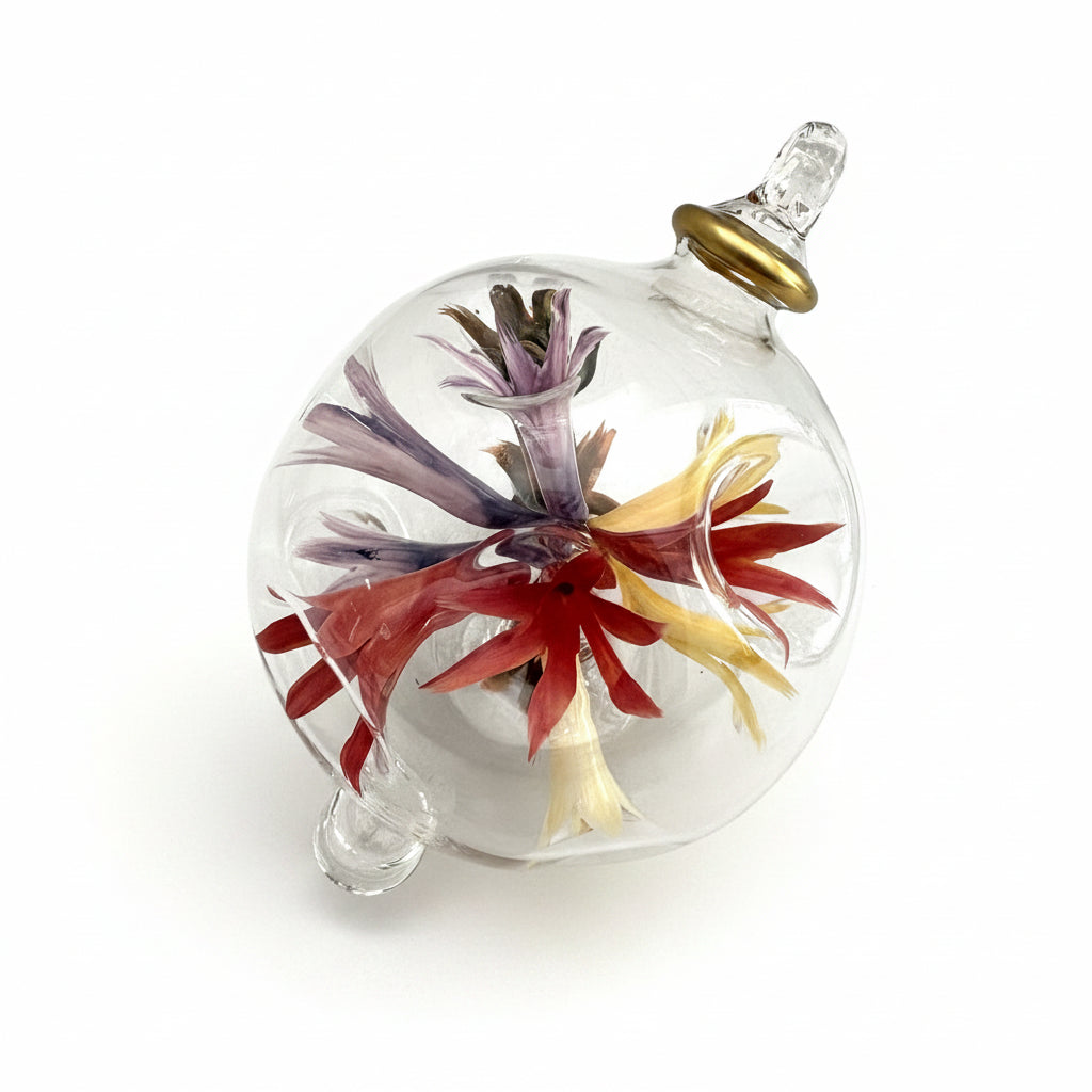 Fair trade hand-blown glass ornament with floral design inspired by Renoir's Bouquet of Chrysantemums, ethically handcrafted