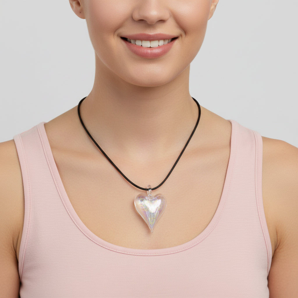 Heart-shaped iridescent clear hand-blown glass pendant on a black cord