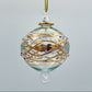Decorative handblown glass Christmas ornaments with intricate designs and gold hilghlights