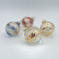 Decorative handblown glass Christmas ornaments with intricate designs and gold hilghlights