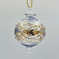 Decorative handblown glass Christmas ornaments with intricate designs and gold hilghlights