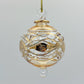 Decorative handblown glass Christmas ornaments with intricate designs and gold hilghlights