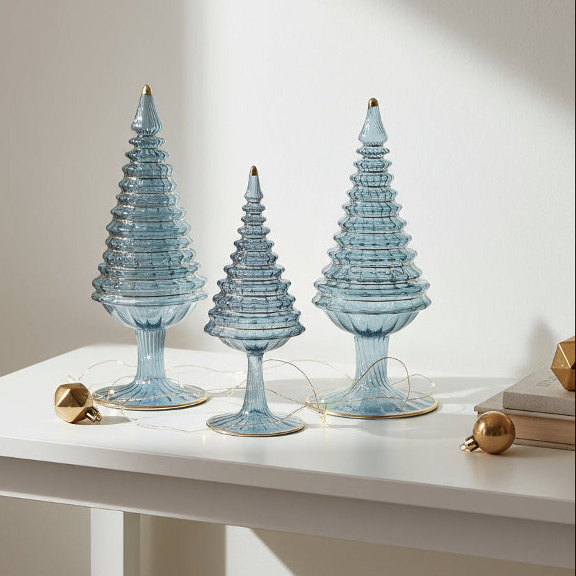 Ethically handcrafted handblown glass Christmas trees in iridescent light blue wiht hand painted gold higlights