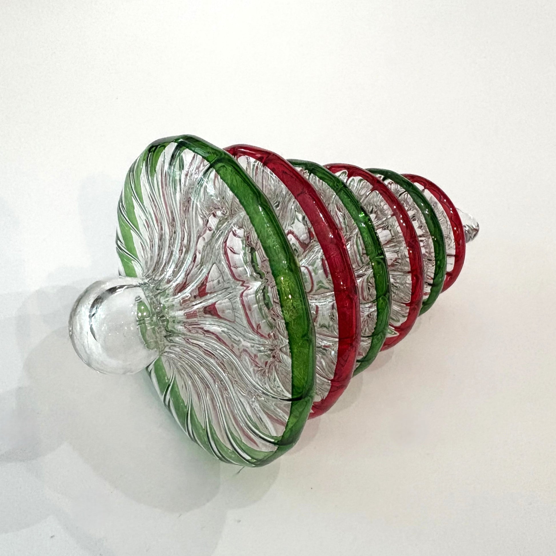 Handblown glass Christmas tree ornament with alternating red and green rings