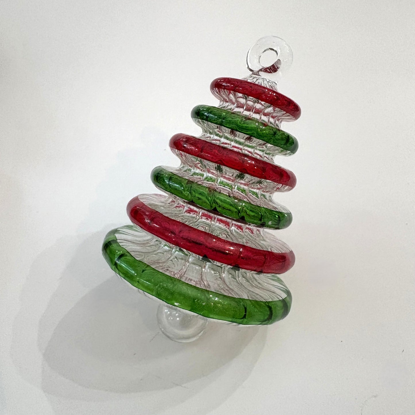Handblown glass Christmas tree ornament with alternating red and green rings