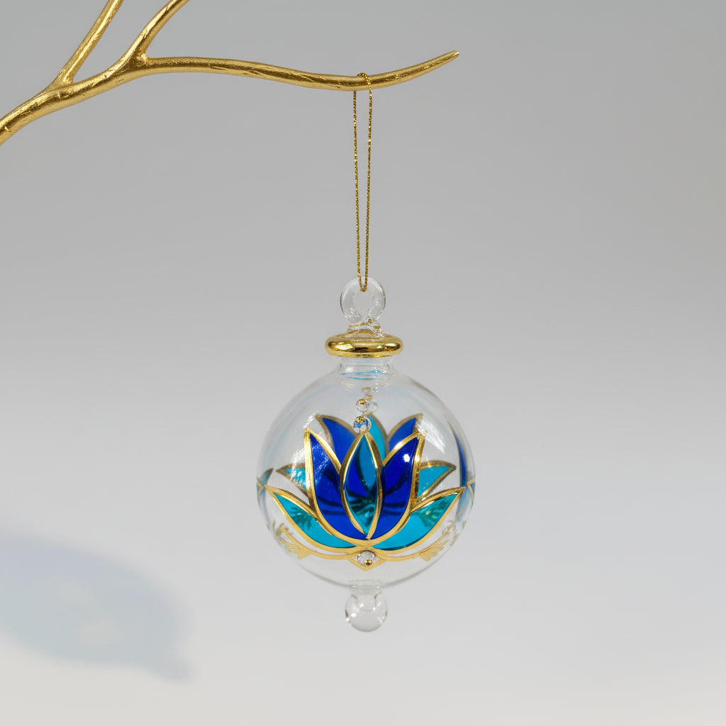 Decorative hand-blown glass bauble with blue, turquoise and gold lotus design
