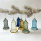 Decorative handblown glass iridescent pastel colored wavy bell ornaments with glass clapper 