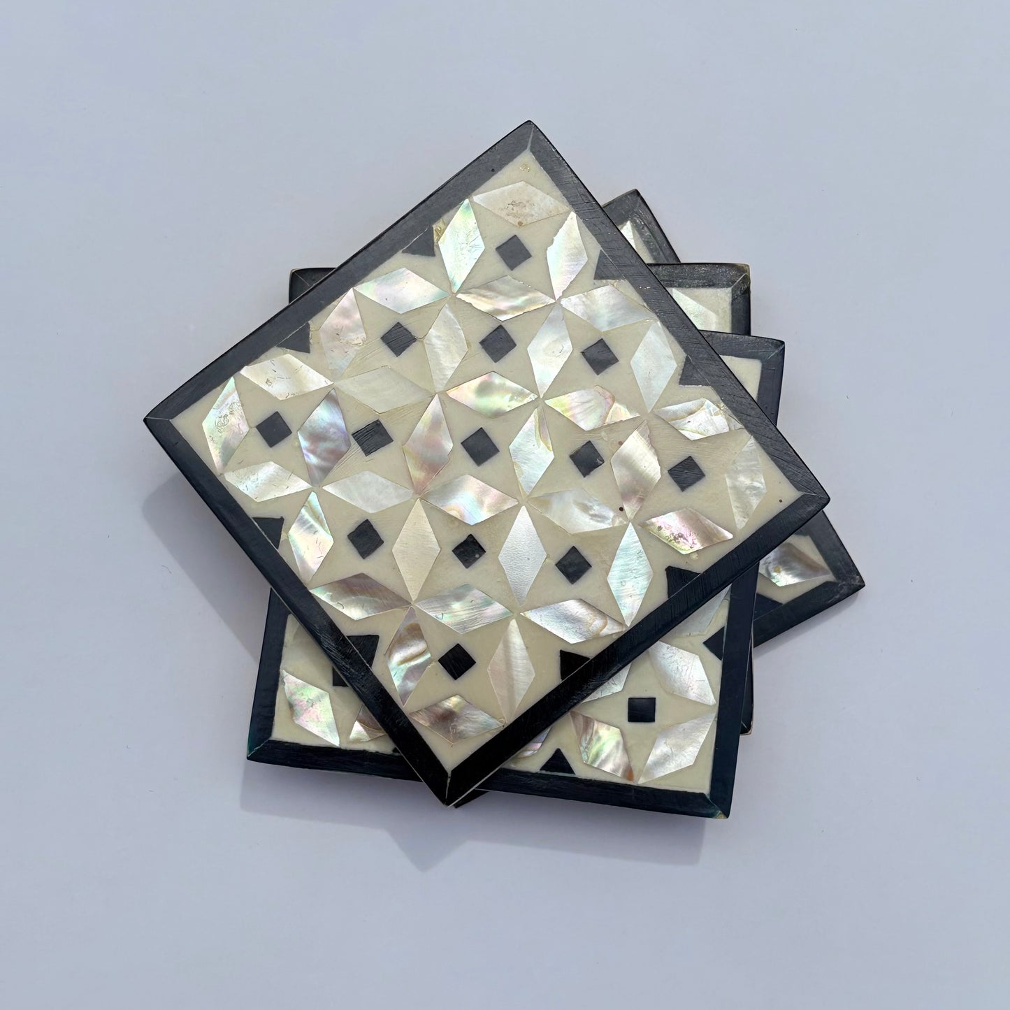 Set of four square wood coasters inlaid with mother of pearl in a geometric pattern, fair trade handmade, arabesque marquetry