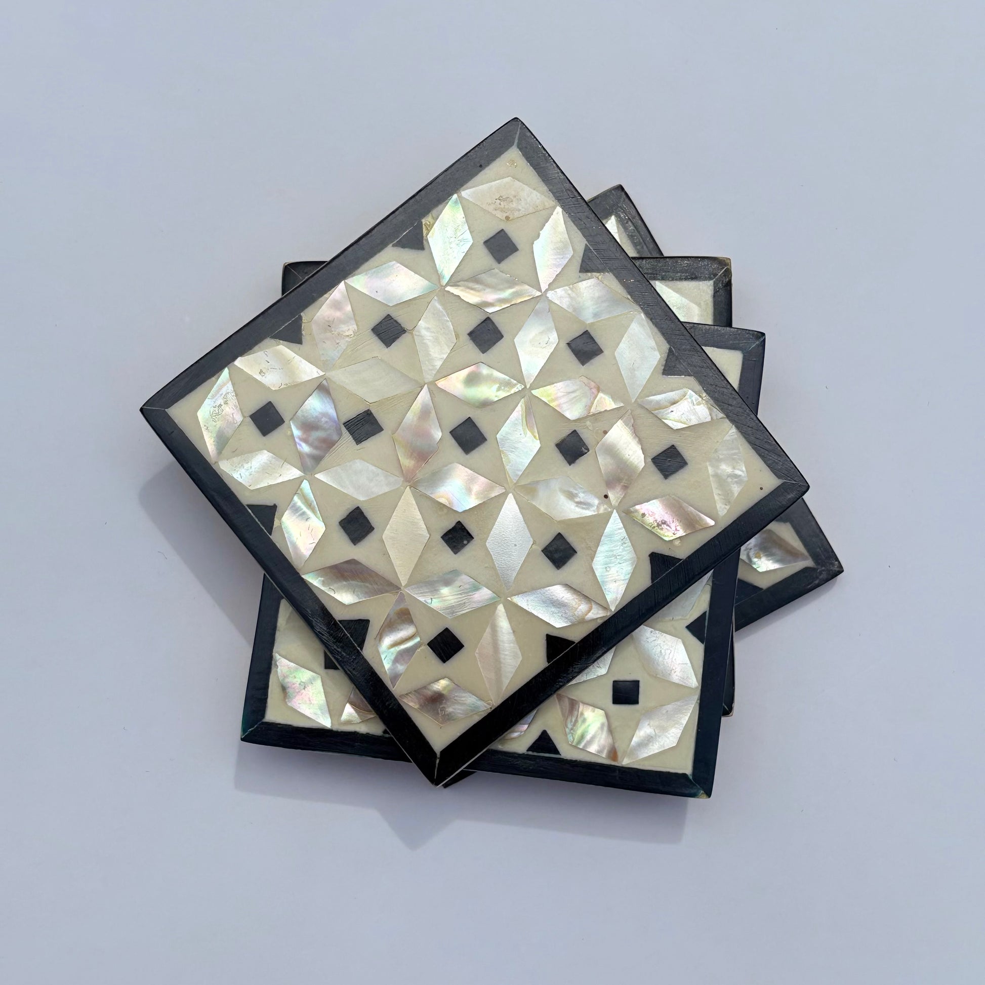 Set of four square wood coasters inlaid with mother of pearl in a geometric pattern, fair trade handmade, arabesque marquetry