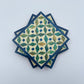 Set of four geometric patterned arabesque wood coasters inlaid with mother of pearl, marquetry, fair trade