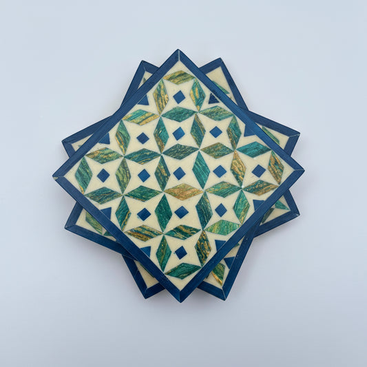 Set of four geometric patterned arabesque wood coasters inlaid with mother of pearl, marquetry, fair trade