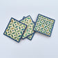 Set of four geometric patterned arabesque wood coasters inlaid with mother of pearl, marquetry, fair trade