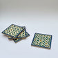 Set of four geometric patterned arabesque wood coasters inlaid with mother of pearl, marquetry, fair trade
