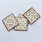 Set of four geometric patterned arabesque wood coasters inlaid with mother of pearl, marquetry, fair trade