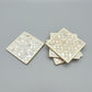 Set of four geometric patterned arabesque wood coasters inlaid with mother of pearl, marquetry, fair trade