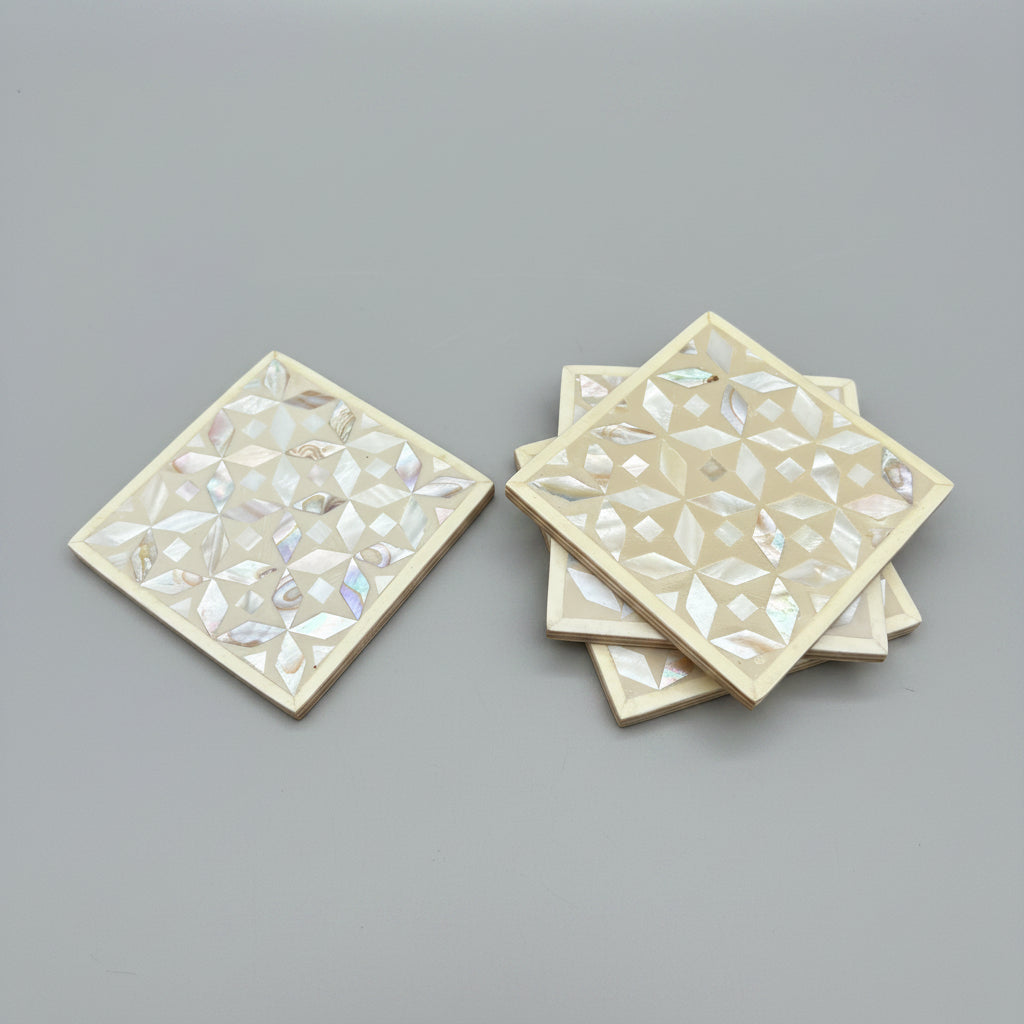 Set of four geometric patterned arabesque wood coasters inlaid with mother of pearl, marquetry, fair trade