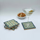 Set of four geometric patterned arabesque wood coasters inlaid with mother of pearl, marquetry, fair trade
