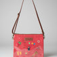 Red handbag with floral and animal hand embroidery on satin, fair trade, sustainable fashion