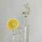 Handmade glass cocktail stirrer decorated with a handcrafted fish with gold detail, fair trade