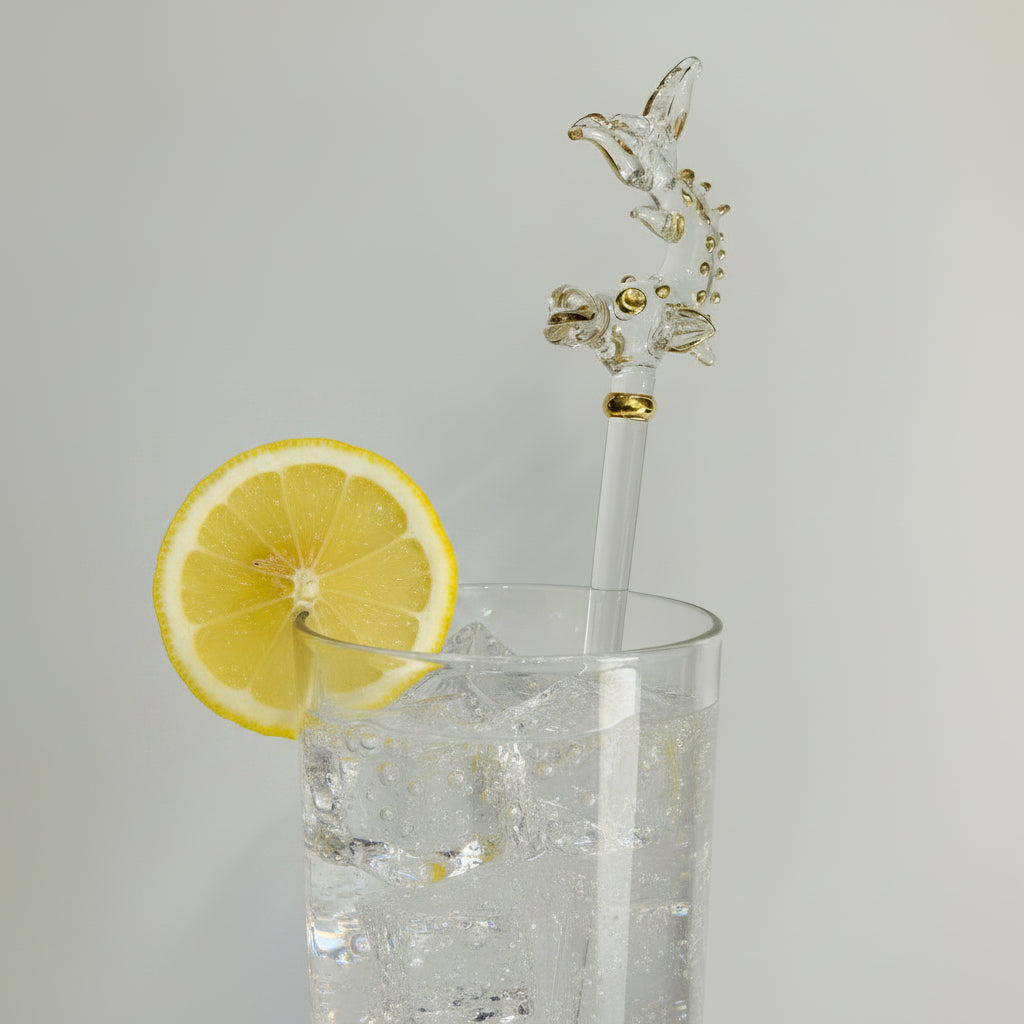 Handmade glass cocktail stirrer decorated with a handcrafted fish with gold detail, fair trade