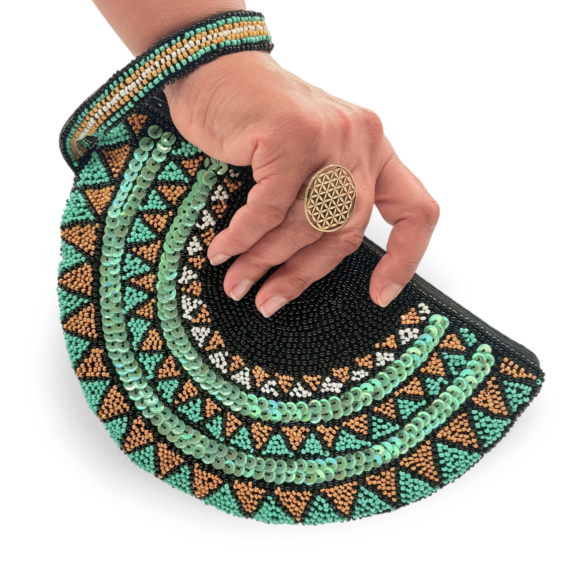 Half moon hand-beaded wristlet clutch with geometric patterns in black & teal