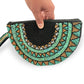 Half moon hand-beaded wristlet clutch with geometric patterns in black & teal