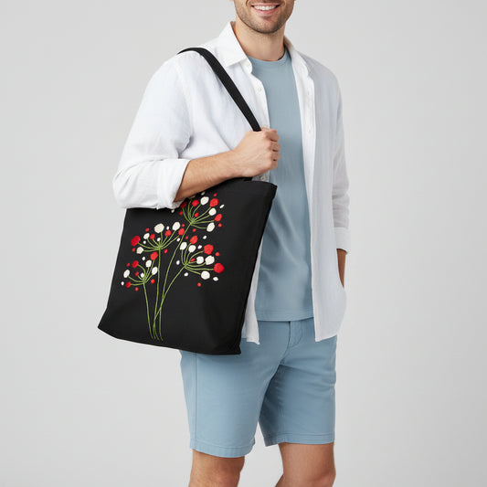 Handmade black tote bag with hand-embroidered red and white floral design, fair trade artisan-made, ethical fashion