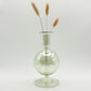 Hand-blown glass bud vase in iridescent green