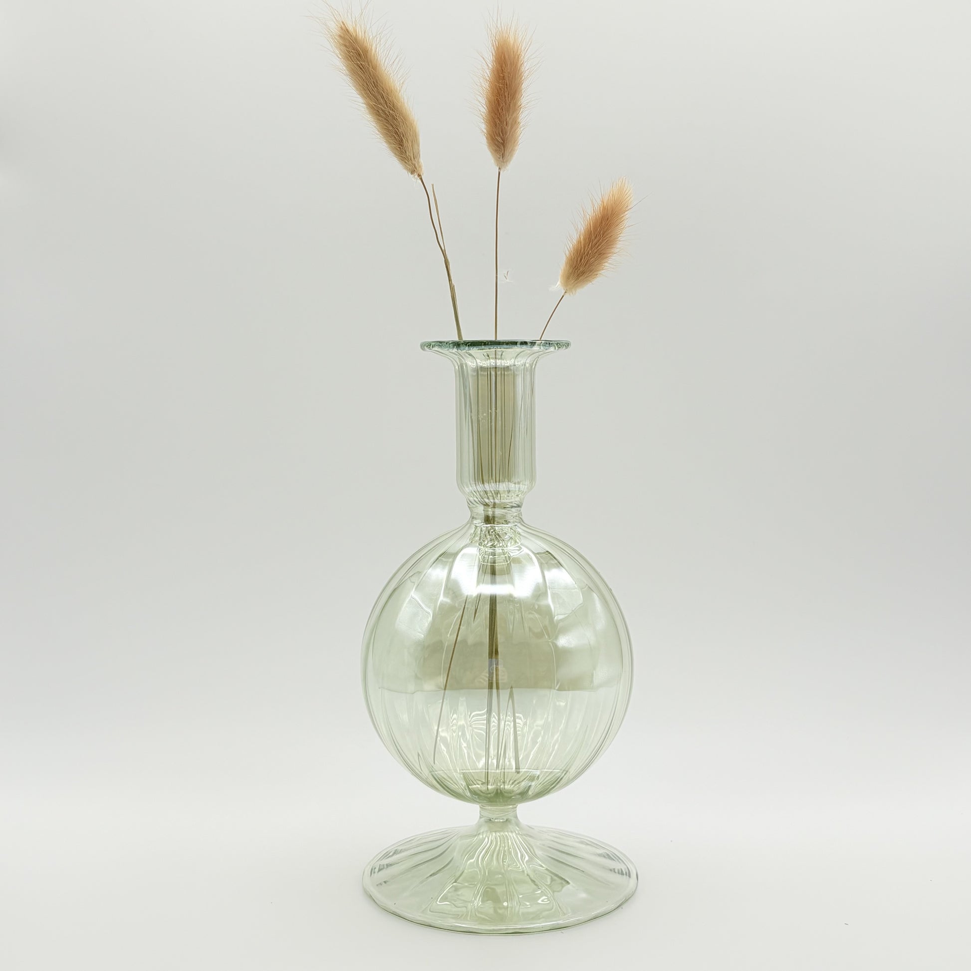 Hand-blown glass bud vase in iridescent green