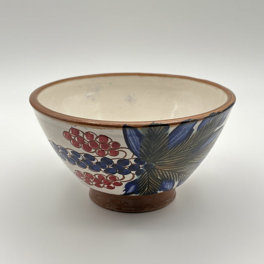 Handcrafted fair trade ceramic bowl with date palm tree design