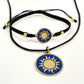 Black macrame bracelet with a brass medallion featuring a gold sun emblem on blue enamel and matching pendant, fair trade handmade