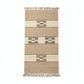 Rectangular handwoven rug with fringes, featuring horizontal stripes and geometric patterns in beige, brown, and cream. Fair trade handcrafted