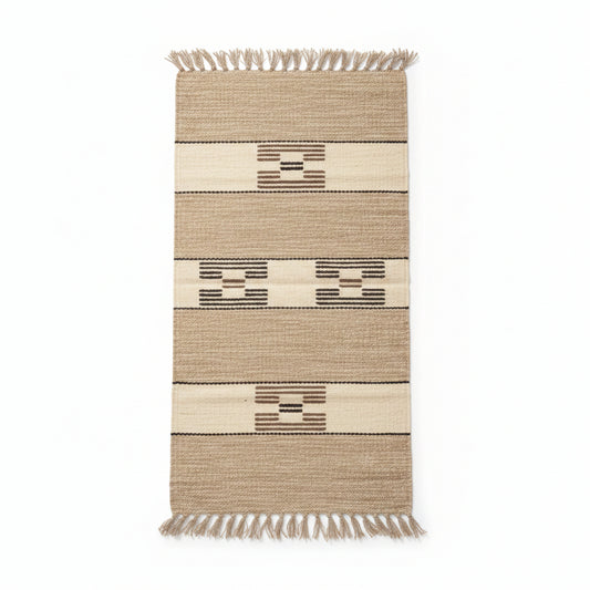 Rectangular handwoven rug with fringes, featuring horizontal stripes and geometric patterns in beige, brown, and cream. Fair trade handcrafted