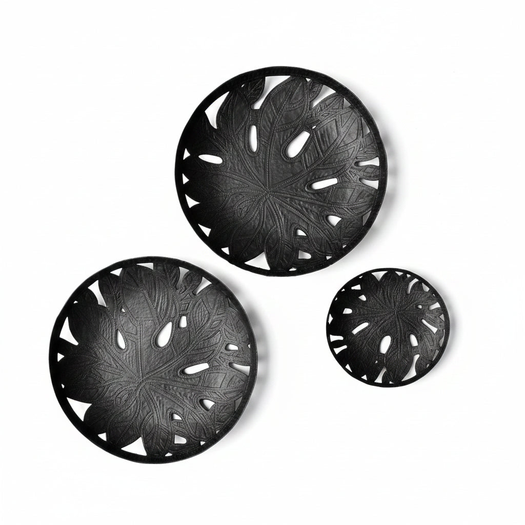 Three handcrafted black leaf-patterned upcycled metal plates for wall decor or tabletop decor, handmade, sustainable