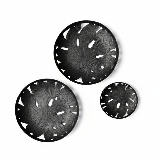 Three handcrafted black leaf-patterned upcycled metal plates for wall decor or tabletop decor, handmade, sustainable