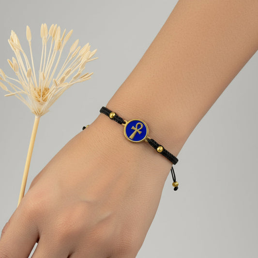 Handmade brass bracelet with an Ankh symbol on a blue enamel background