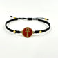 Handmade brass bracelet with an Ankh symbol on a maroon red enamel background
