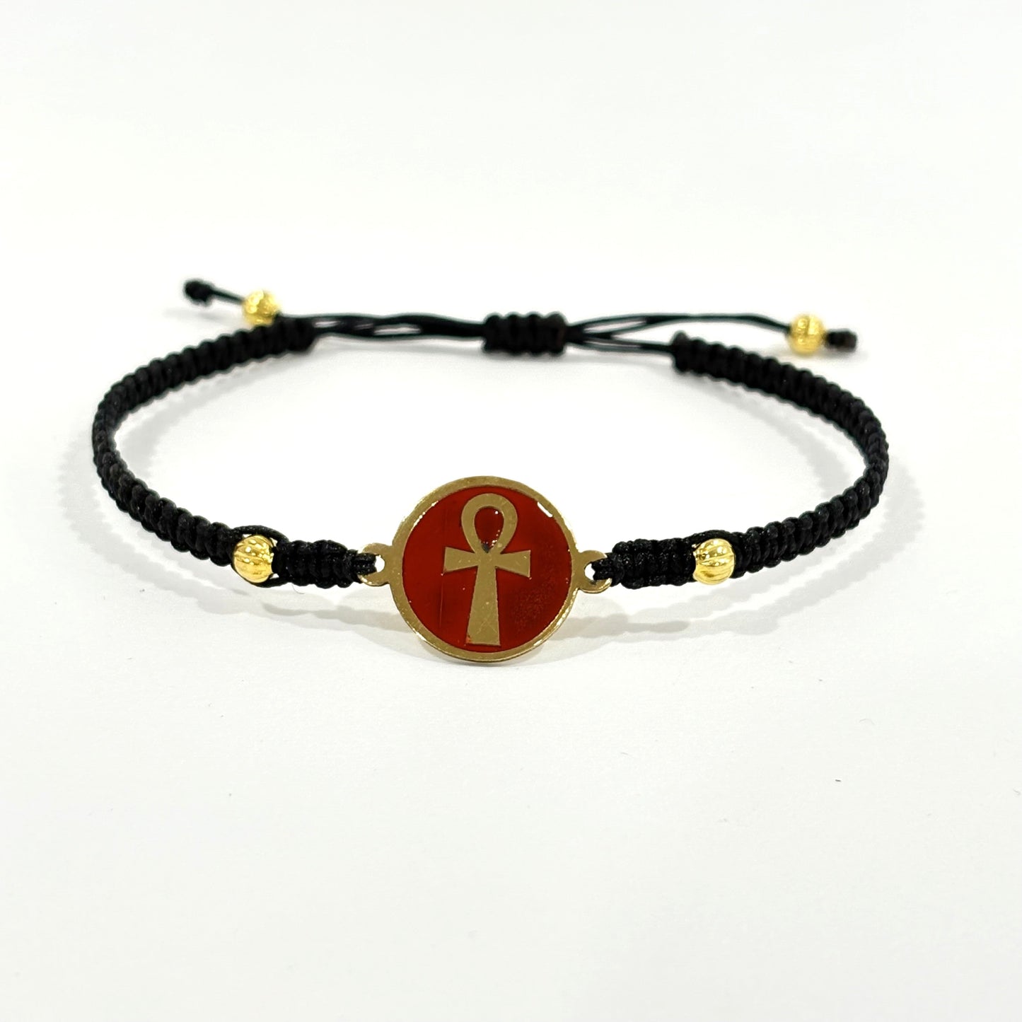 Handmade brass bracelet with an Ankh symbol on a maroon red enamel background