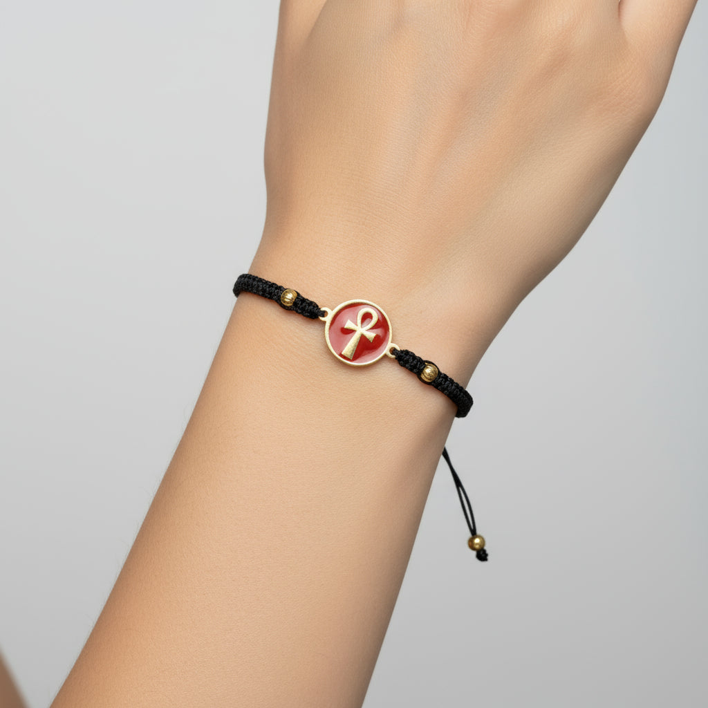 Handmade brass bracelet with an Ankh symbol on a maroon red enamel background