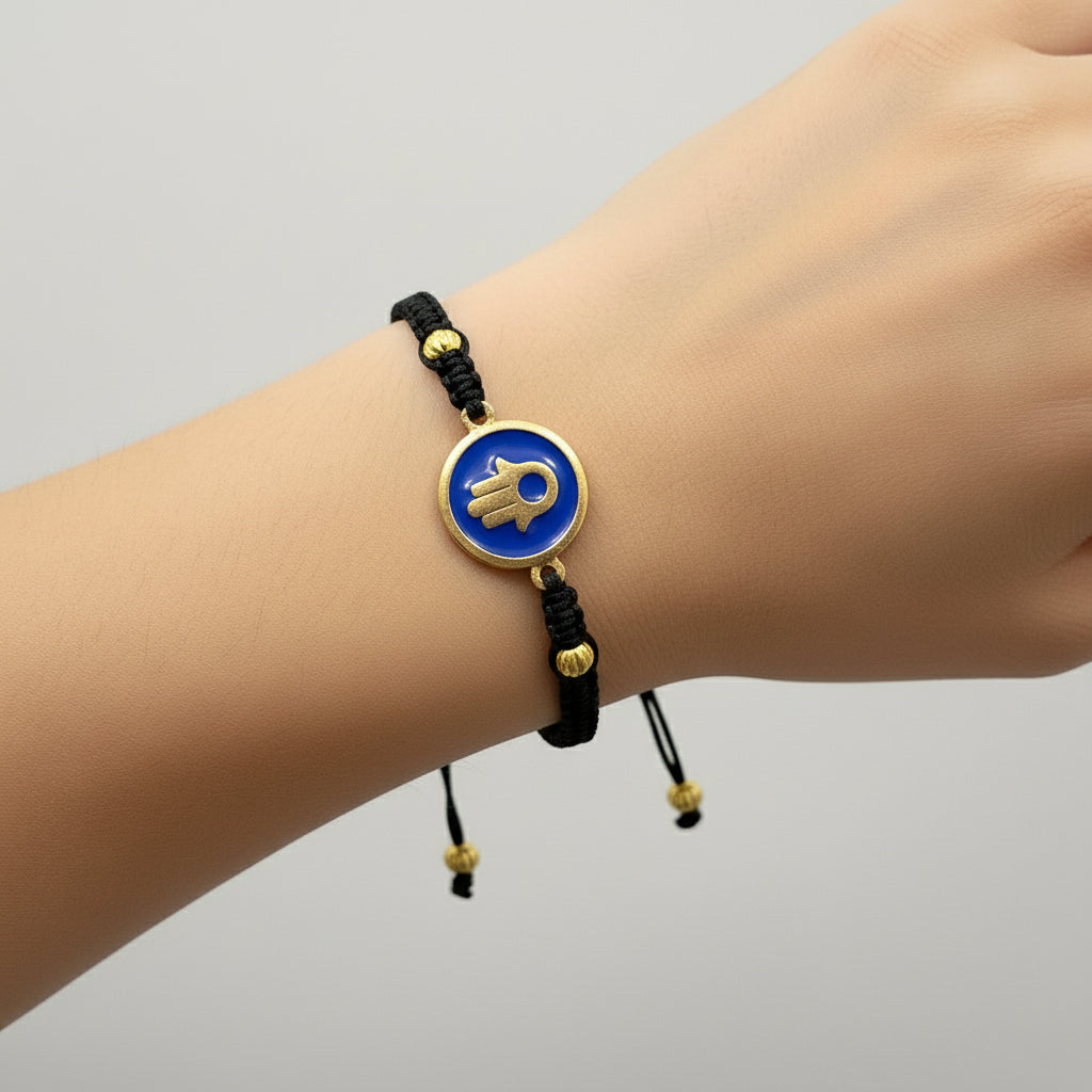 Handmade brass bracelet with a Hamsa symbol on a blue enamel background, fair trade, ethically handcrafted