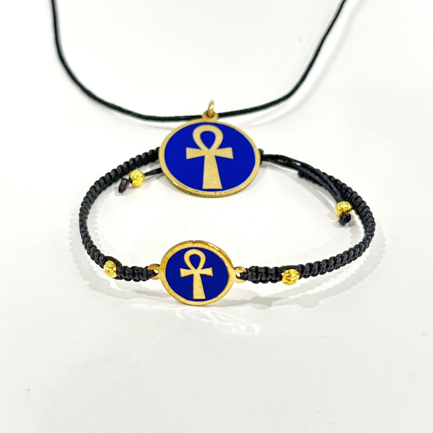 Necklace and bracelet with a blue medallion featuring a gold ankh symbol, handmade of brass