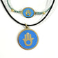 Handmade brass bracelet and pendant with a Hamsa symbol on a turquoise enamel background on black cord, fair trade, ethically handcrafted