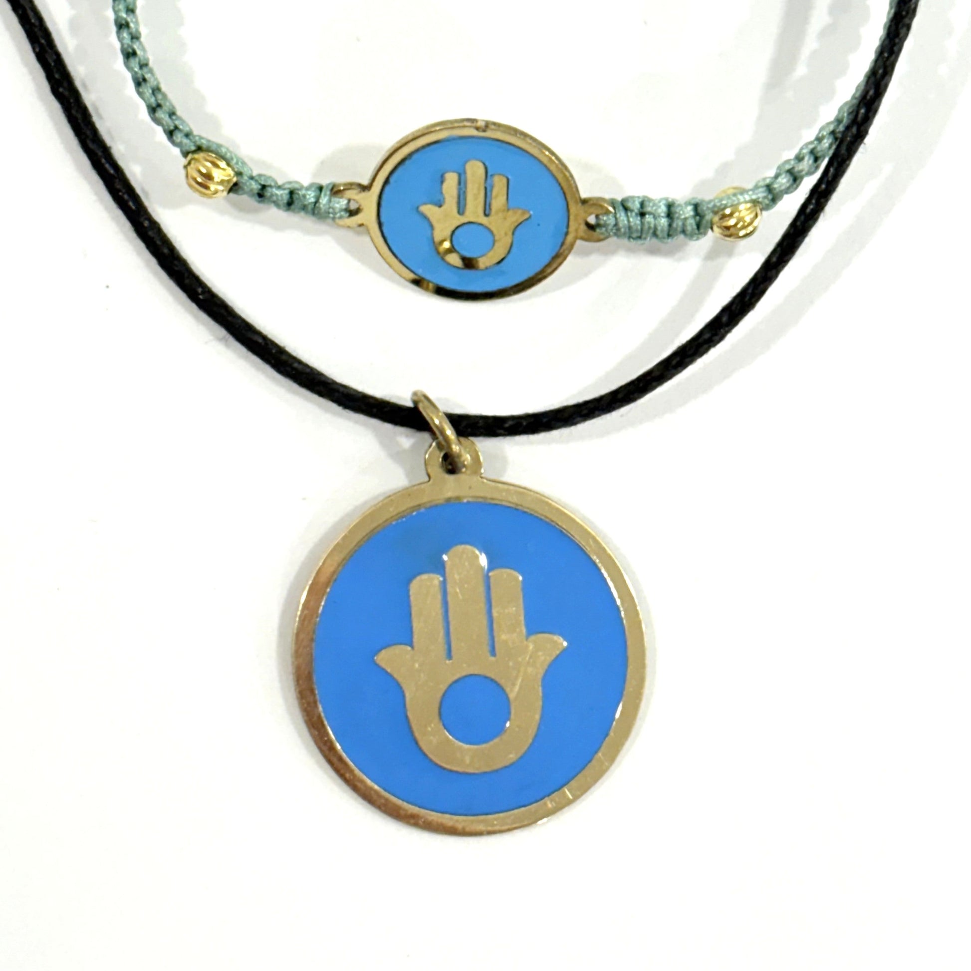 Handmade brass bracelet and pendant with a Hamsa symbol on a turquoise enamel background on black cord, fair trade, ethically handcrafted