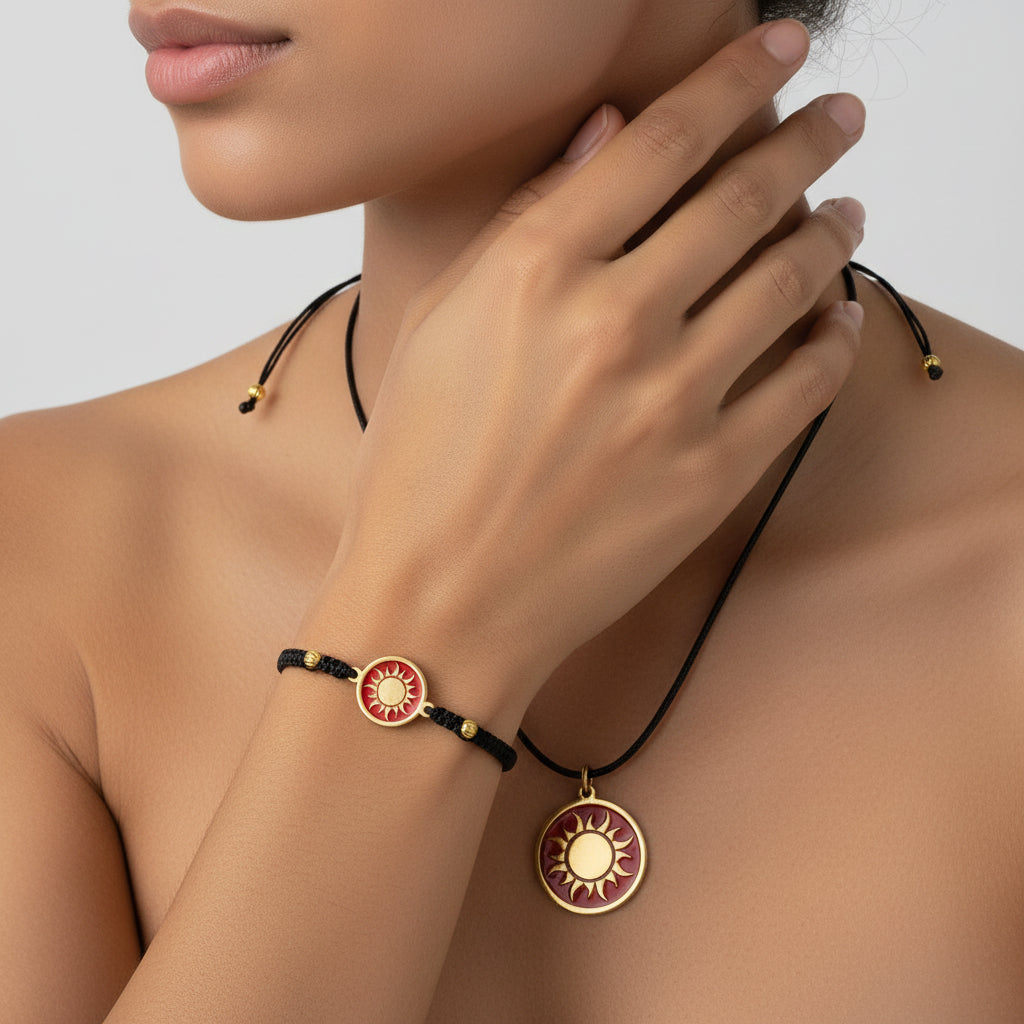 Black macrame bracelet with a brass medallion featuring a gold sun emblem on maroon enamel and matching pendant, fair trade handmade