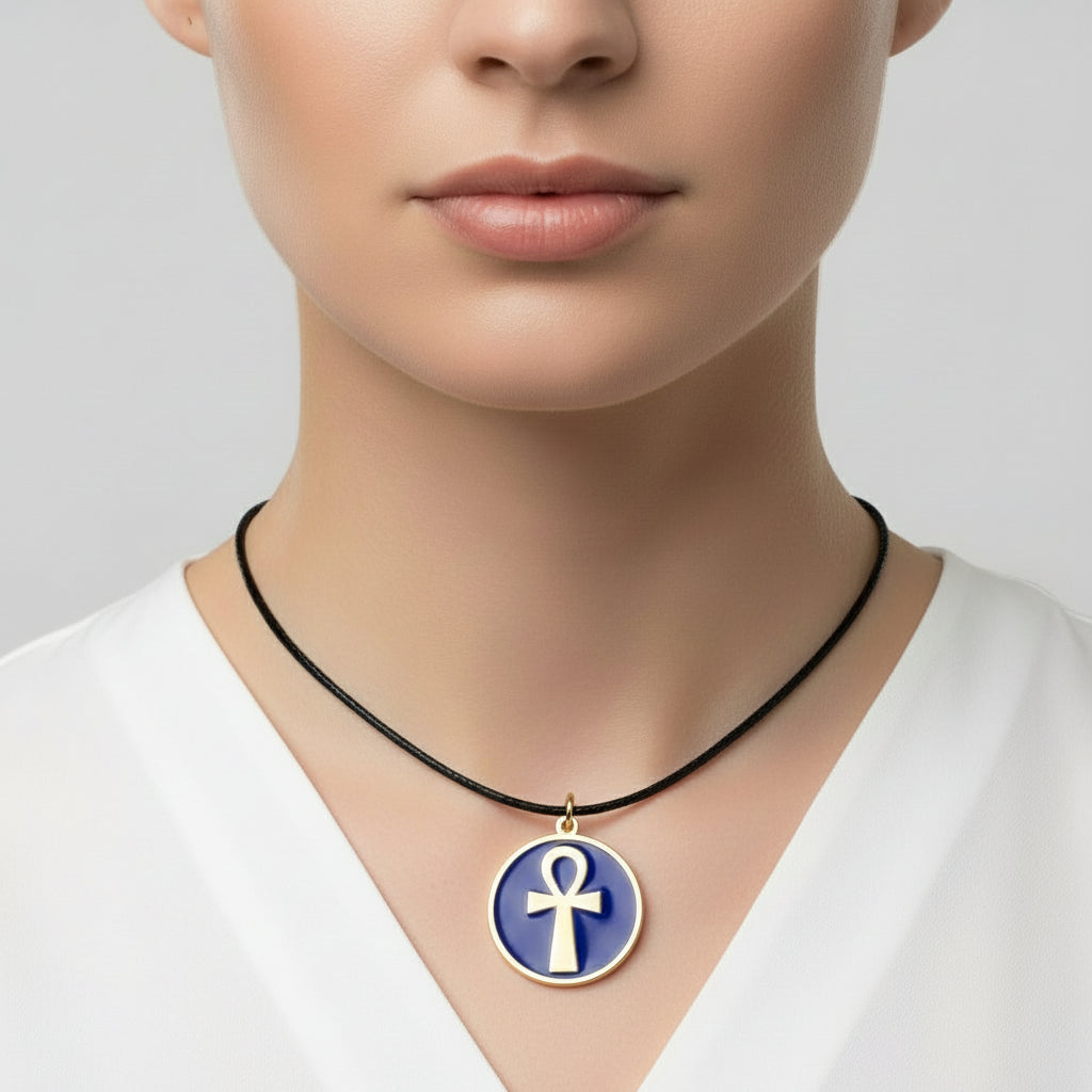 Necklace with a blue pendant featuring a gold ankh symbol, handmade of brass