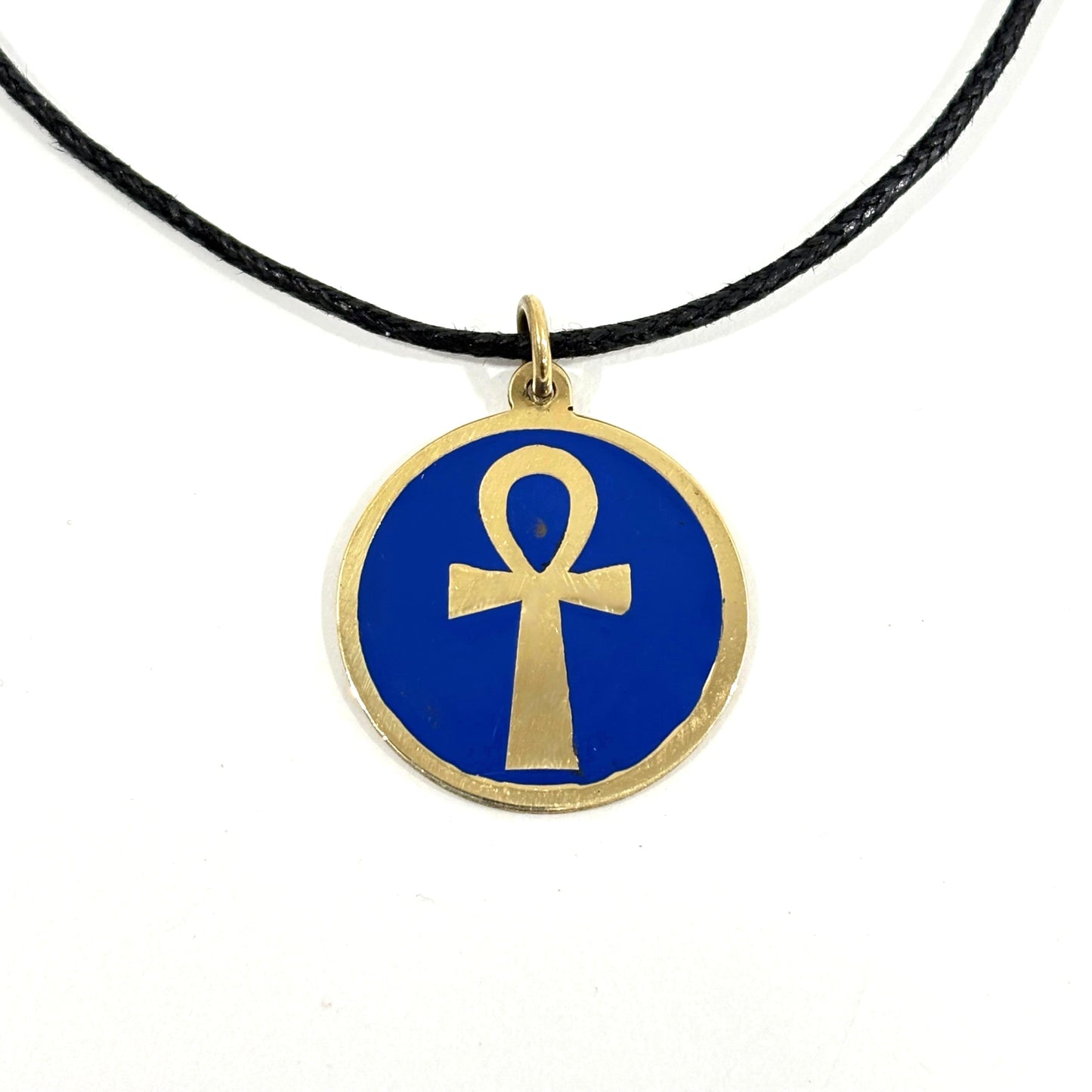 Necklace with a blue pendant featuring a gold ankh symbol, handmade of brass