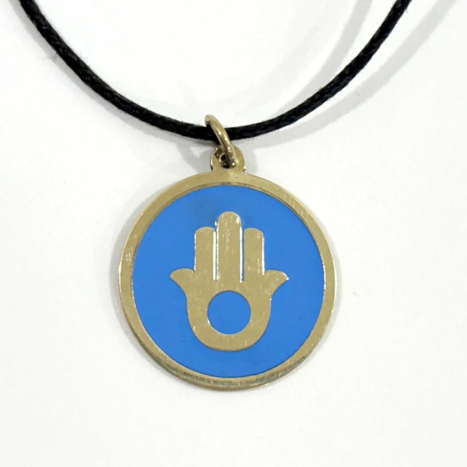 Handmade brass pendant with gold Hamsa hand on turquoise enamel on a black cord, fair trade, ethically handmade
