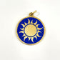 Fair trade handmade brass pendant featuring gold sun against blue enamel