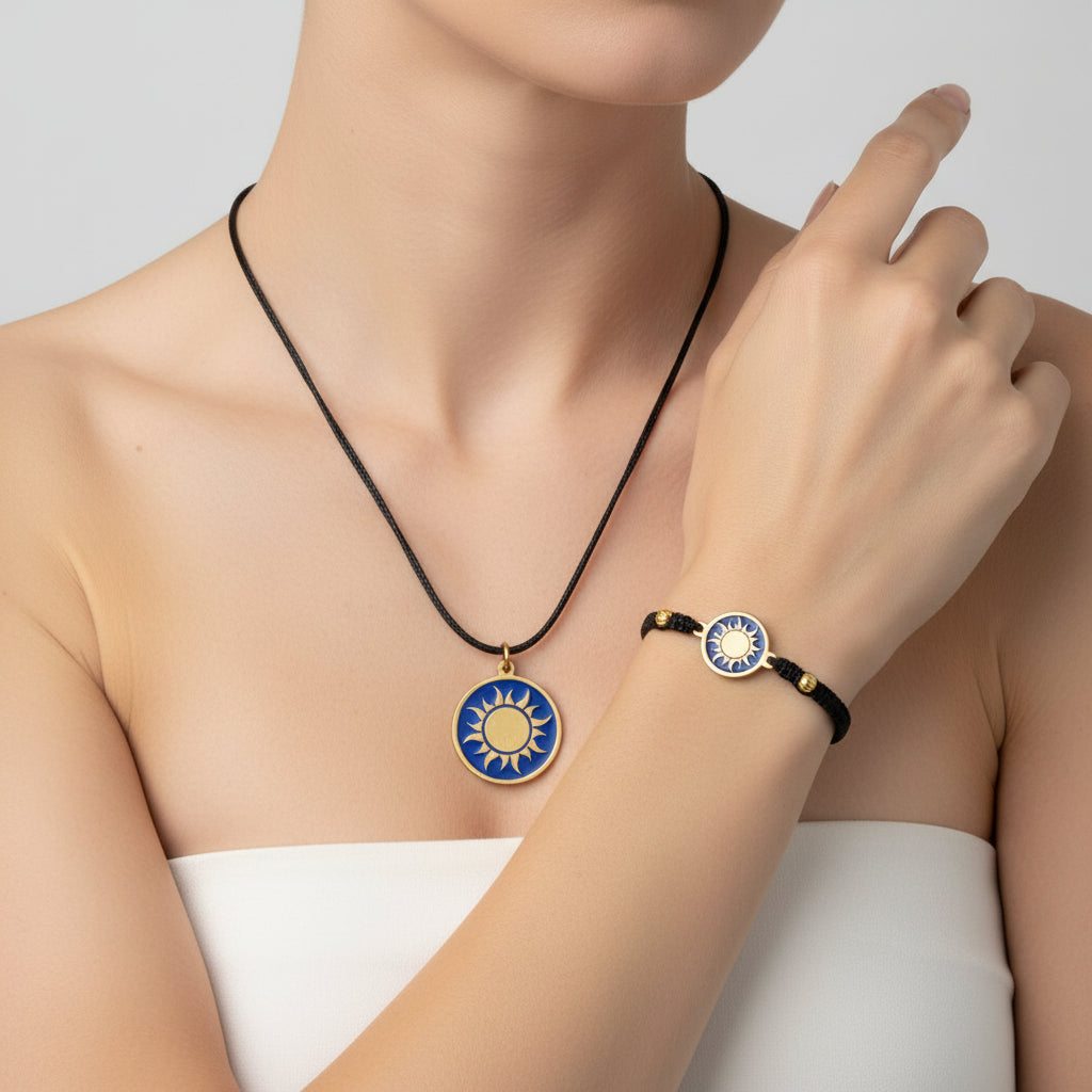 Black macrame bracelet with a brass medallion featuring a gold sun emblem on blue enamel and matching pendant, fair trade handmade
